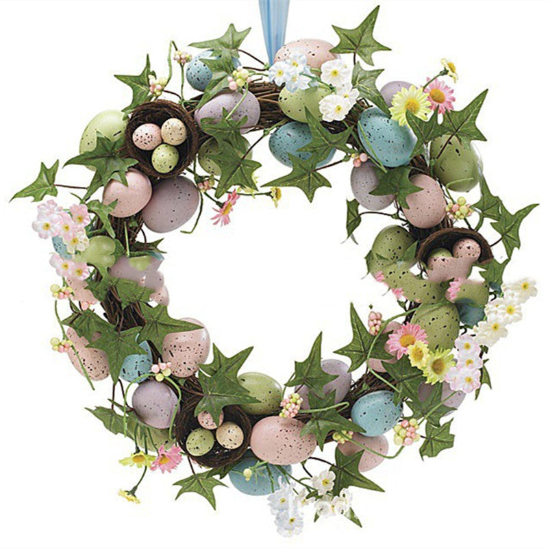 Decorative wreath with Easter eggs and flowers on a white background