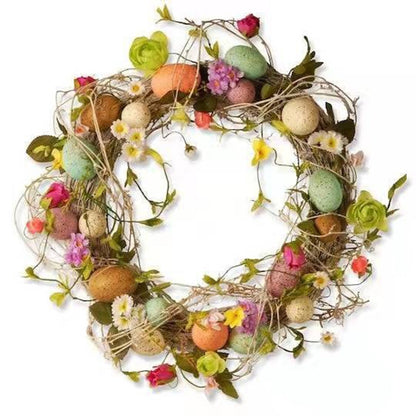 Decorative Easter wreath with eggs and flowers on a white background