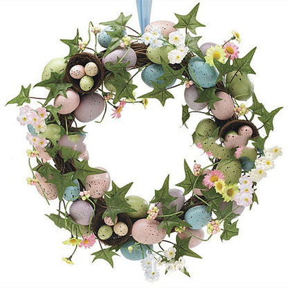 Decorative wreath with Easter eggs and flowers on a white background
