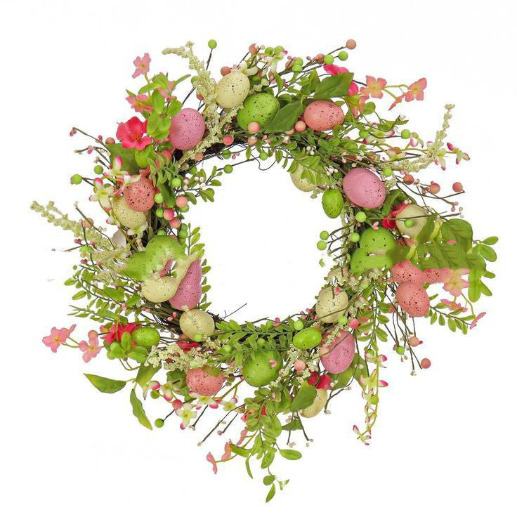 Decorative wreath with green eggs, pink flowers, and leaves on a white background